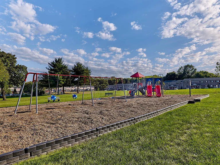 Village Square playground and lush landscaping.