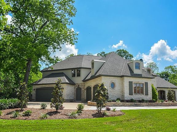 This country estate offers casual elegance with superior quality inside and out. There are garages to house up to 4 vehicles including a golf cart area. One bay can be a great workshop/storage with AC which was once used a serious wine cellar!