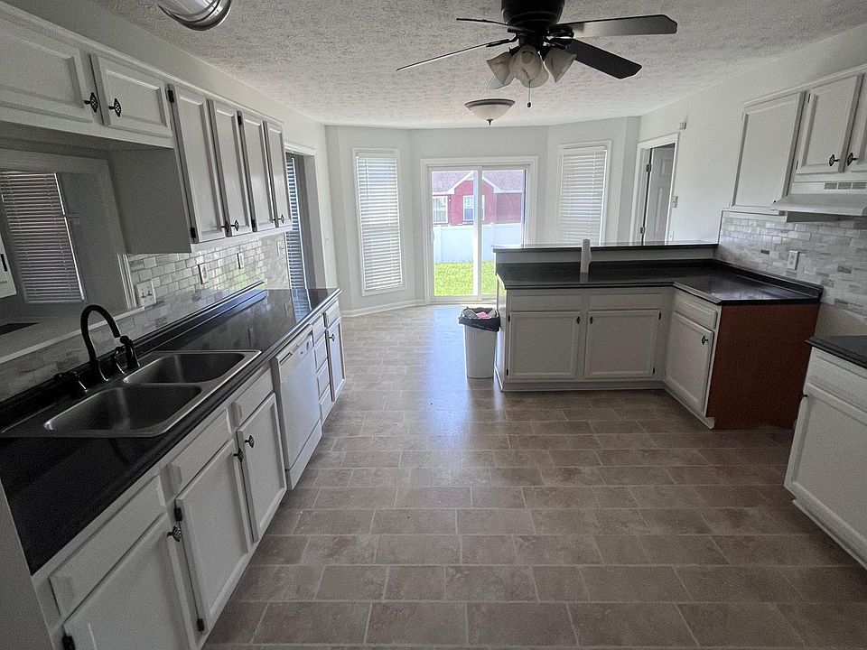 Kitchen looking towards rear slider to back yard