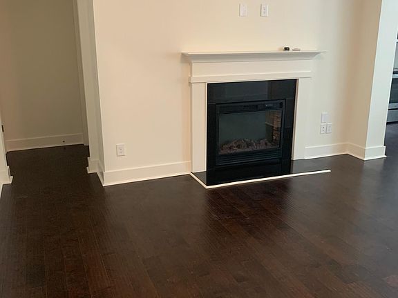 Family Room with Fireplace and Coffered Ceiling