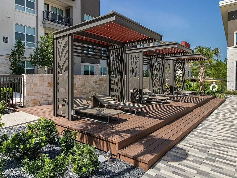 Resort-style pool with cabanas
