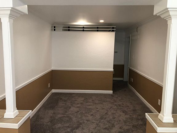 View from front door to living rm & hallway. Bedroom on each side of hallway.