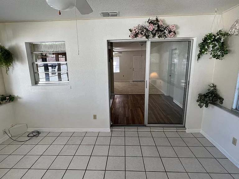Sliding door between sunroom and dining room.