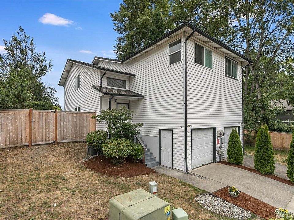 Freshly painted front stairs and landing.  Man door to single-car garage with ample storage above.