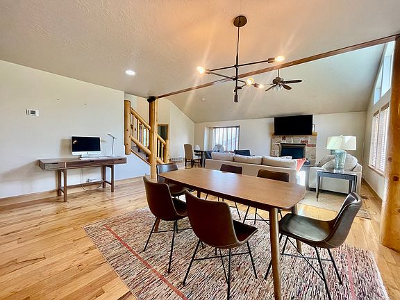 Open floor plan with dining table towards living room