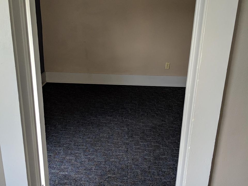 This photo was taken standing in the living room looking into the first bedroom. This bedroom has one south facing window.