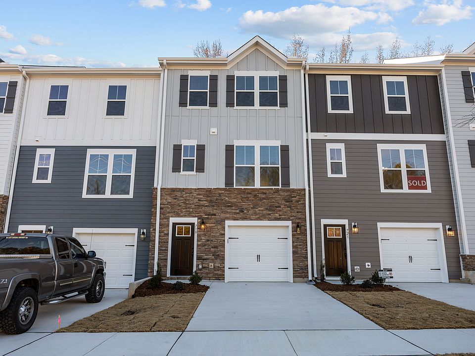 Fiber cement and stone exterior with shutters. Single car garage. Neighborhood sidewalks.