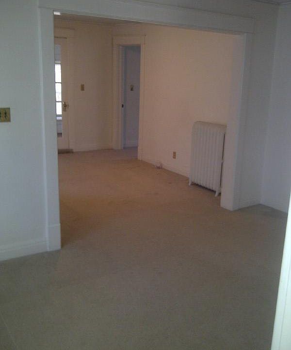 view from kitchen through dining room, living room toward front bedroom/office