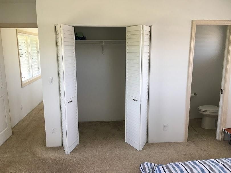 Master bedroom closet and 1/2 bath.