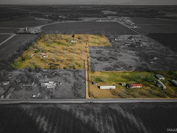 The highlighted area by the road is not included.