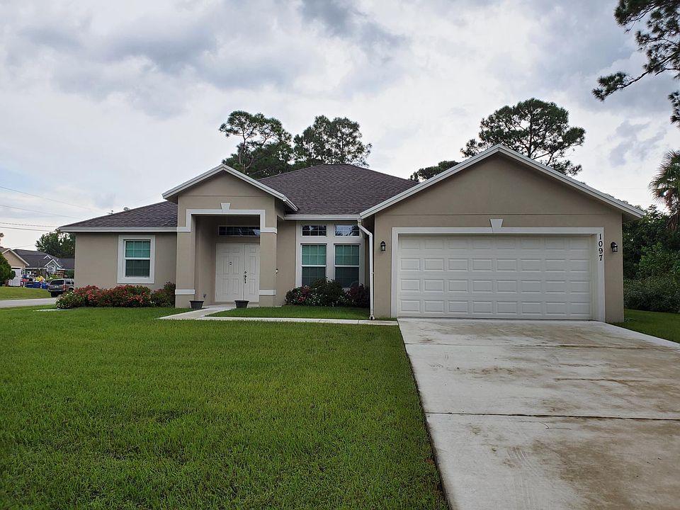 Front of House, empty lot on side of house