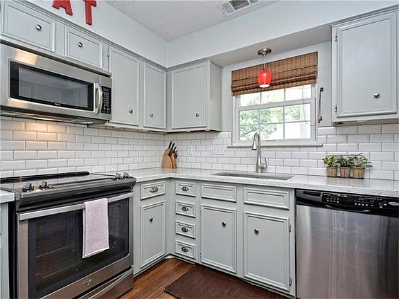 Updated kitchen with newer appliances, Corian counters, undermount sink, new hardward/fixtures. All appliances included.  See attached docs for details.