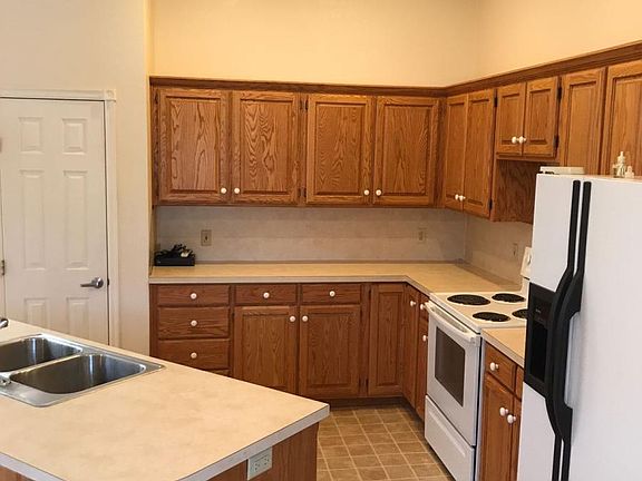 Kitchen side view with door to pantry