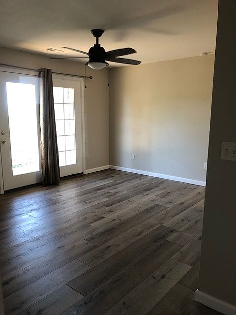 Newer flooring walks out to deck with a spacious storage closet