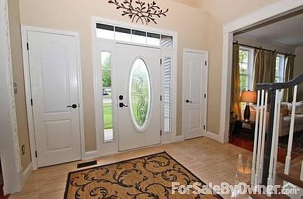 Warm and Inviting
						:
						This bright 2 story foyer features Italian porcelain tile.