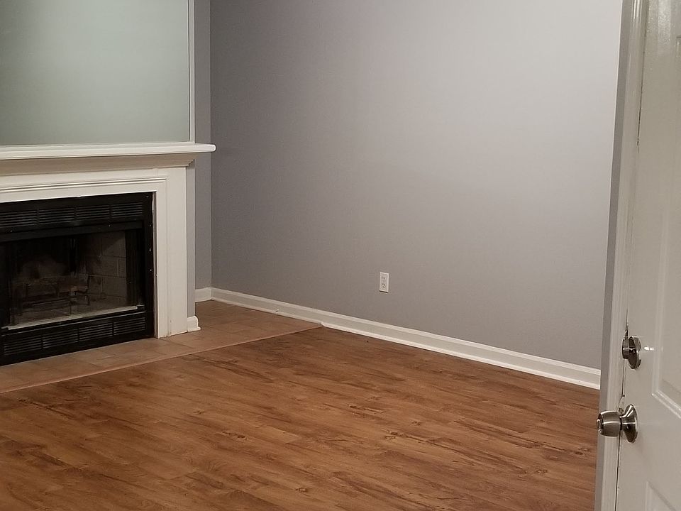 Front door entrance and living room with fireplace.