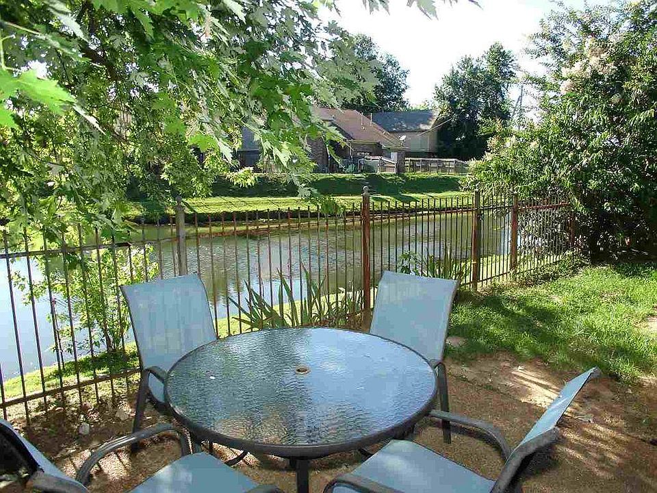 Serene backyard with water view.