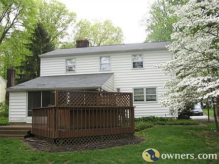 Rear view of house, screened porch and deck