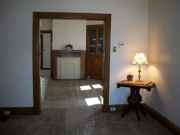 Livingroom, lots of original woodwork, high ceilings