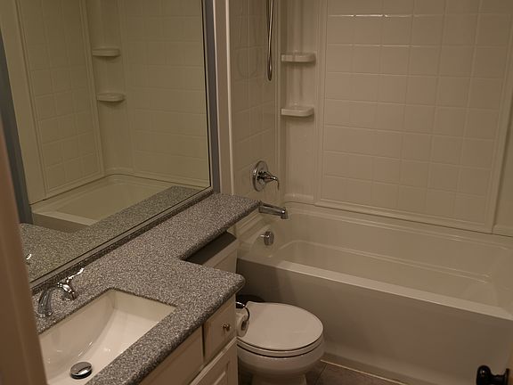 Efficient upstairs bathroom with LVP flooring.
