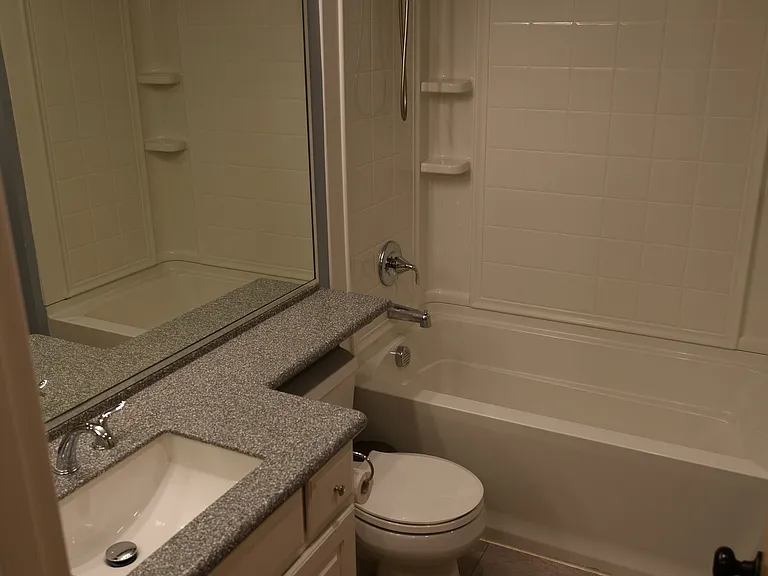 Efficient upstairs bathroom with LVP flooring.