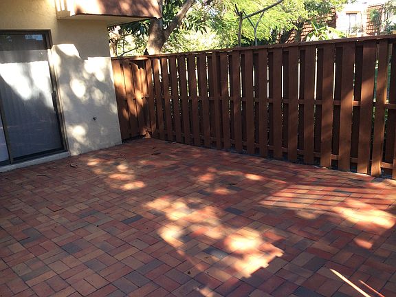 Fenced Brick Paver Courtyard