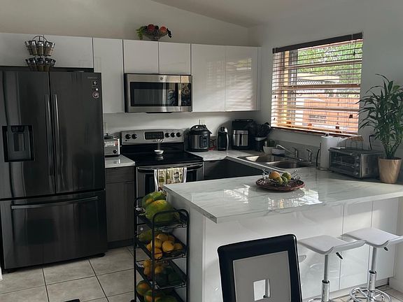 Kitchen has been remodeled, it's open and gets lots of natural light.