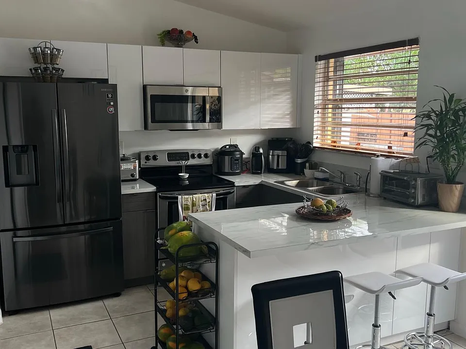 Kitchen has been remodeled, it's open and gets lots of natural light.