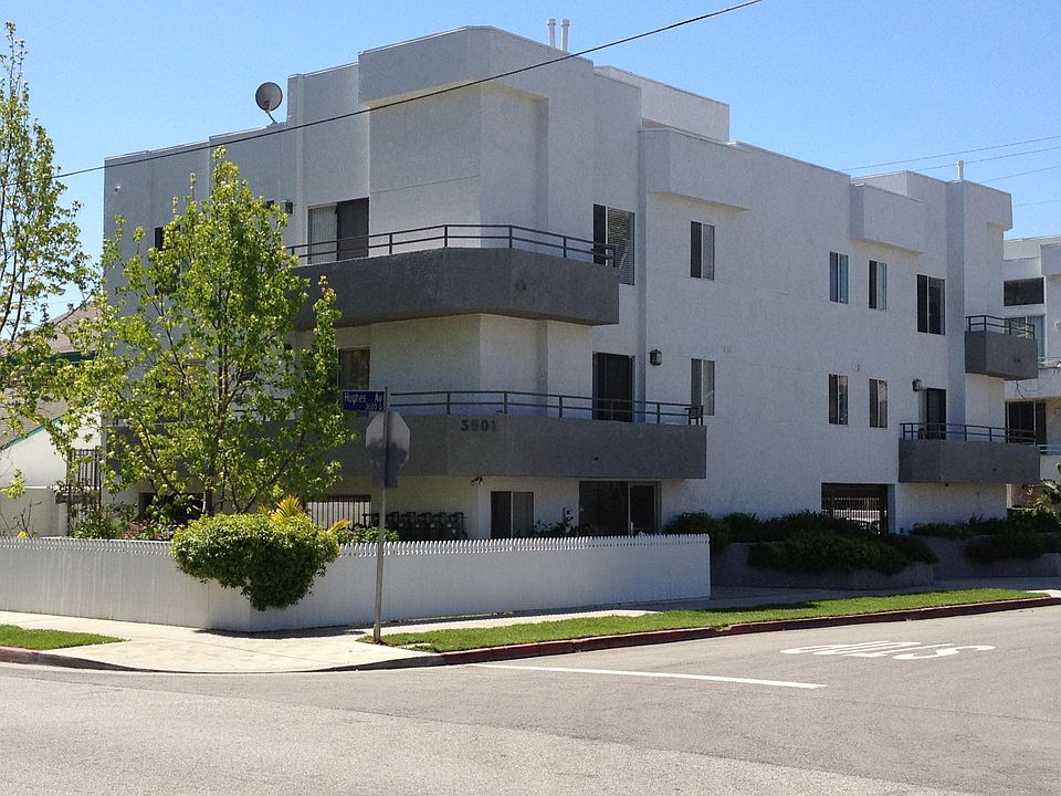 Exterior of 5-unit apartment building. Private rooftop patio is located in the middle of the building, at the front.