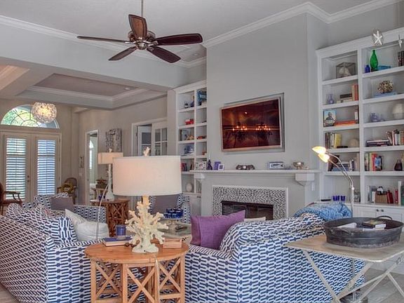 Cozy fireplace and built in bookcases.