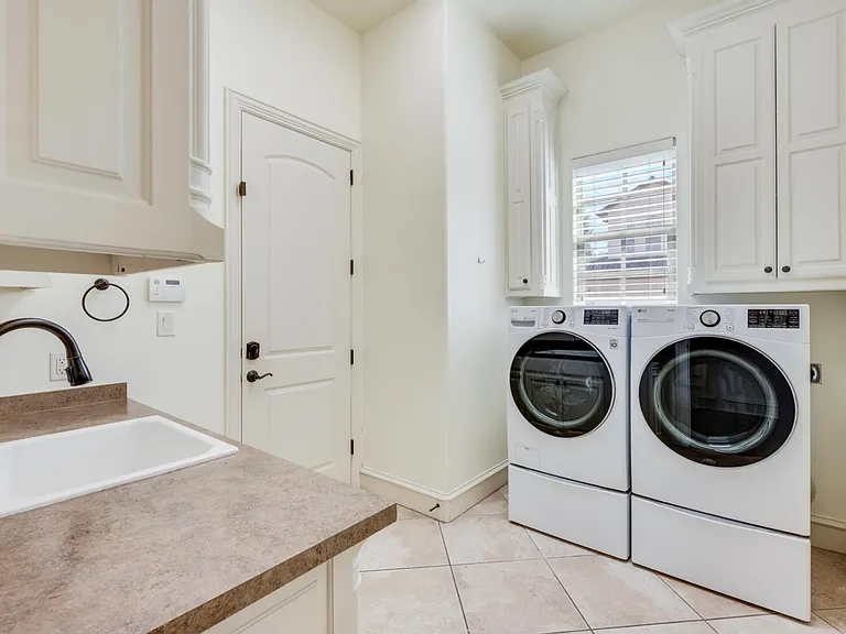 Laundry Room contains large washer and dryer
