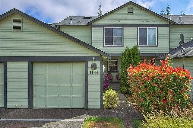 Front of townhome, attached garage.