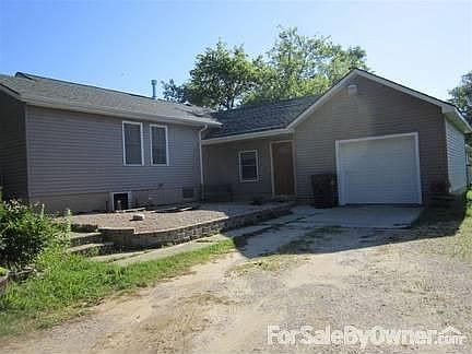 Front of house showing 1.5 car attached