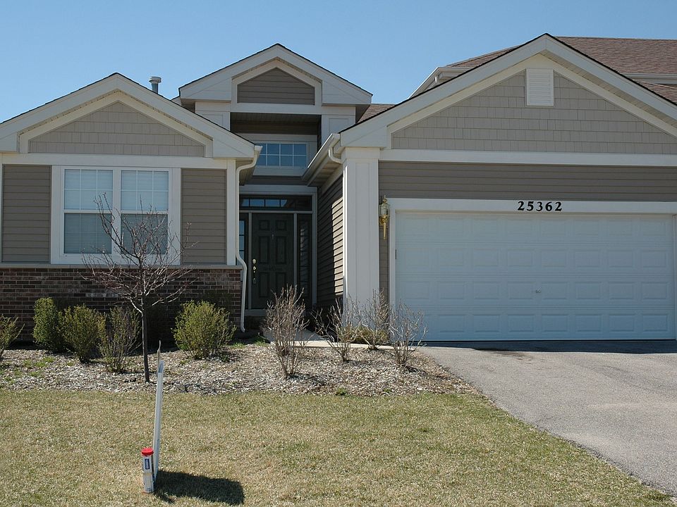 Front view with 2 car garage