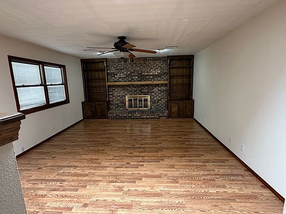 Living room with sky light, fireplace and walk out to patio