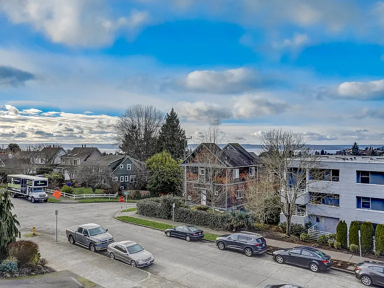 An aerial view of the building and its surroundings, showcasing the convenient location and the neighborhood's layout, offering a comprehensive perspective of the area.