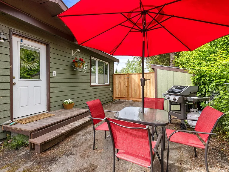 outside eating/private space with grill and sitting area