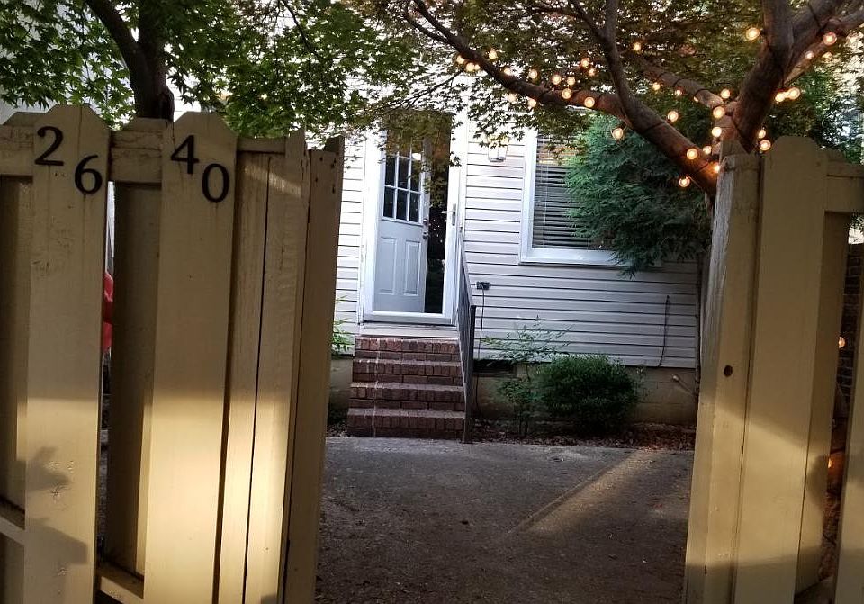 Gate from two car carport enters into kitchen/dining area