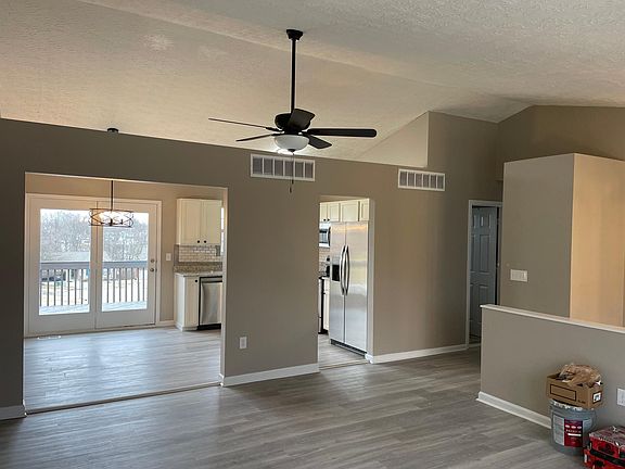 Looking from great room into kitchen. Cathedral ceiling and lots of natural light.