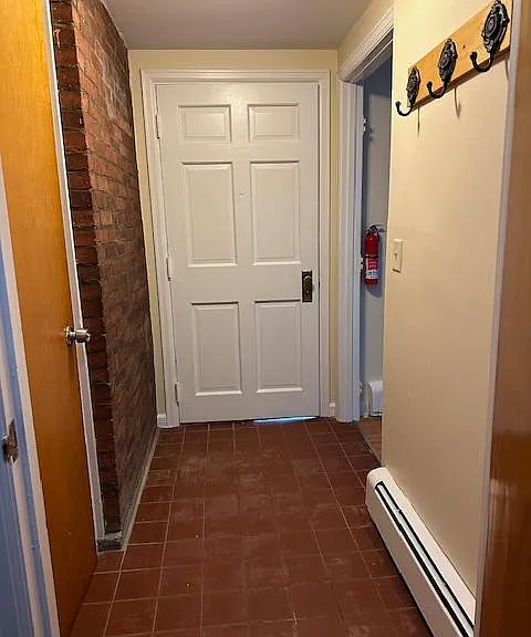 Entry/Mud Room from Willards Street Side facing door that leads to the hall with laundry room and parking lot access