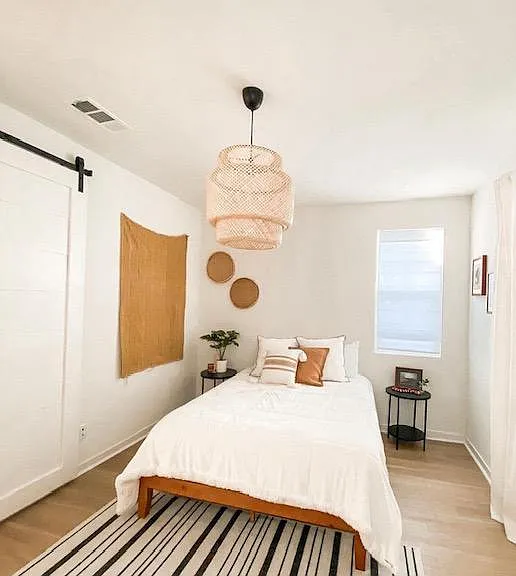 Downstairs guest bedroom with farmhouse style sliding door
