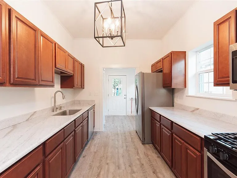 Large kitchen with gas range, granite, and an amazing amount of cabinetry/storage.