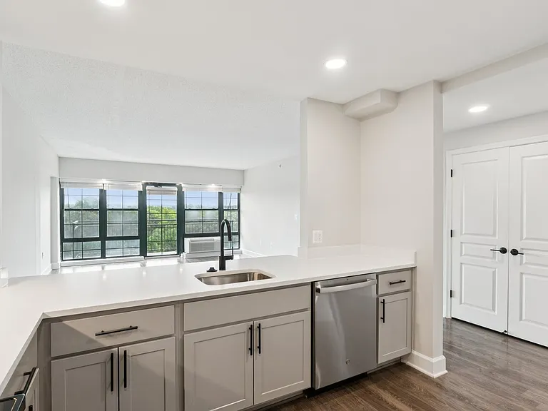 Select homes feature upgraded kitchens with quartz countertops and wood flooring