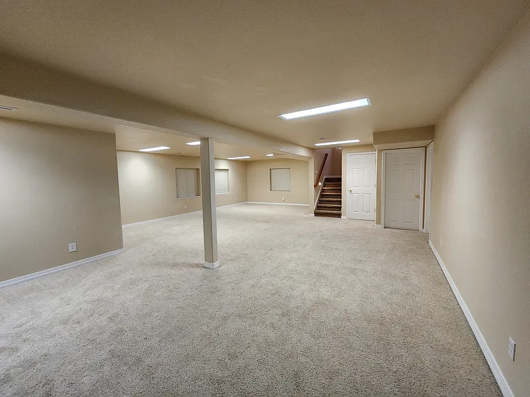 Large Downstairs Rec Room - Looking from Hallway to Downstairs Bedrooms back towards the stairs