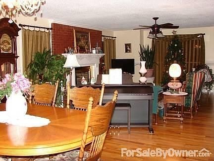 Dining and Living Room : Comfortable and cozy open arrangement. Warm and inviting fireplace to enjoy