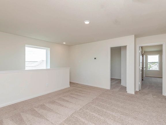 An upstairs flex room gives you space for a playroom, fitness space or home office.