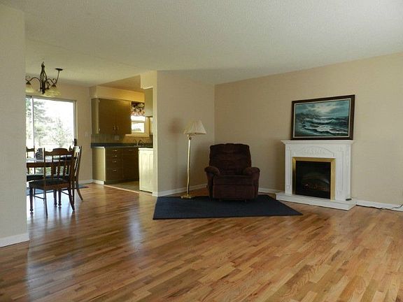 The floor plan is open and flows easily to the wonderful back yard. The electric "fireplace" will remain with the house.