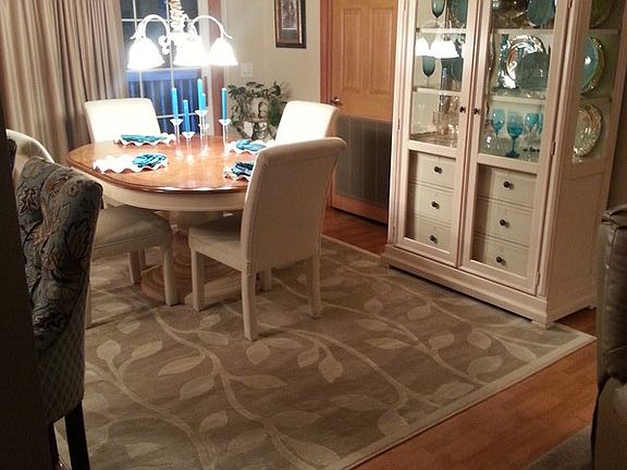 Comfortable dining with deck views. : Double doors offer light and fresh air or close the drapes for
