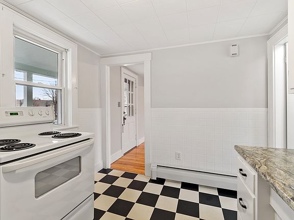 Kitchen with door to dining room and bathroom to the right.