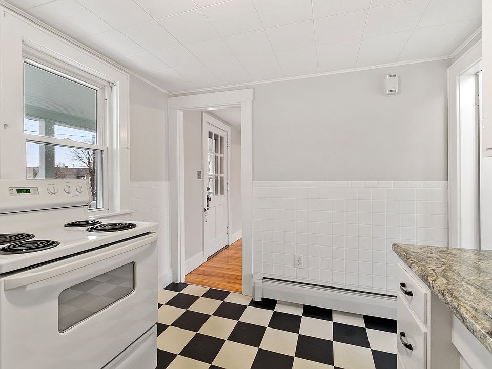 Kitchen with door to dining room and bathroom to the right.